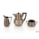 An Orvit pewter cream jug and sugar bowl; and a Wa