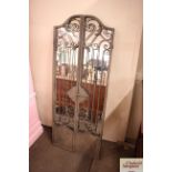 A wrought metal shutter door mirror, 150cm x 60cm