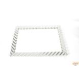 A large silvered framed wall mirror, 82cm x 110cm