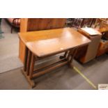 A 1930's oak fold under drop leaf table, 120cm wid