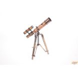 A brass and leather bound telescope on tripod stan
