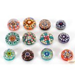 Twelve Millefiori glass paperweights