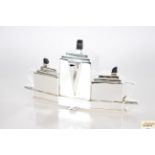 An Art Deco design three piece plated tea set on i