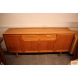 A large teak G-plan style sideboard, fitted long centra