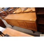 A teak Beautility sideboard fitted three drawers f