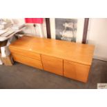 A teak low sideboard fitted double cupboard and tw