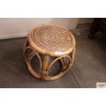 A rattan and bamboo barrel shaped occasional table