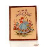 An embroidery depicting a crinoline lady in a gard