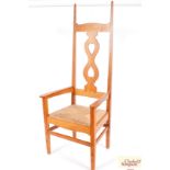 A golden oak throne chair in the manner of C.F.A.