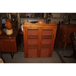 An early 20th Century stripped pine wall cabinet f