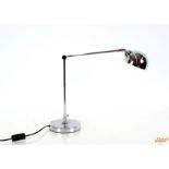 A chrome plated angle poise style lamp