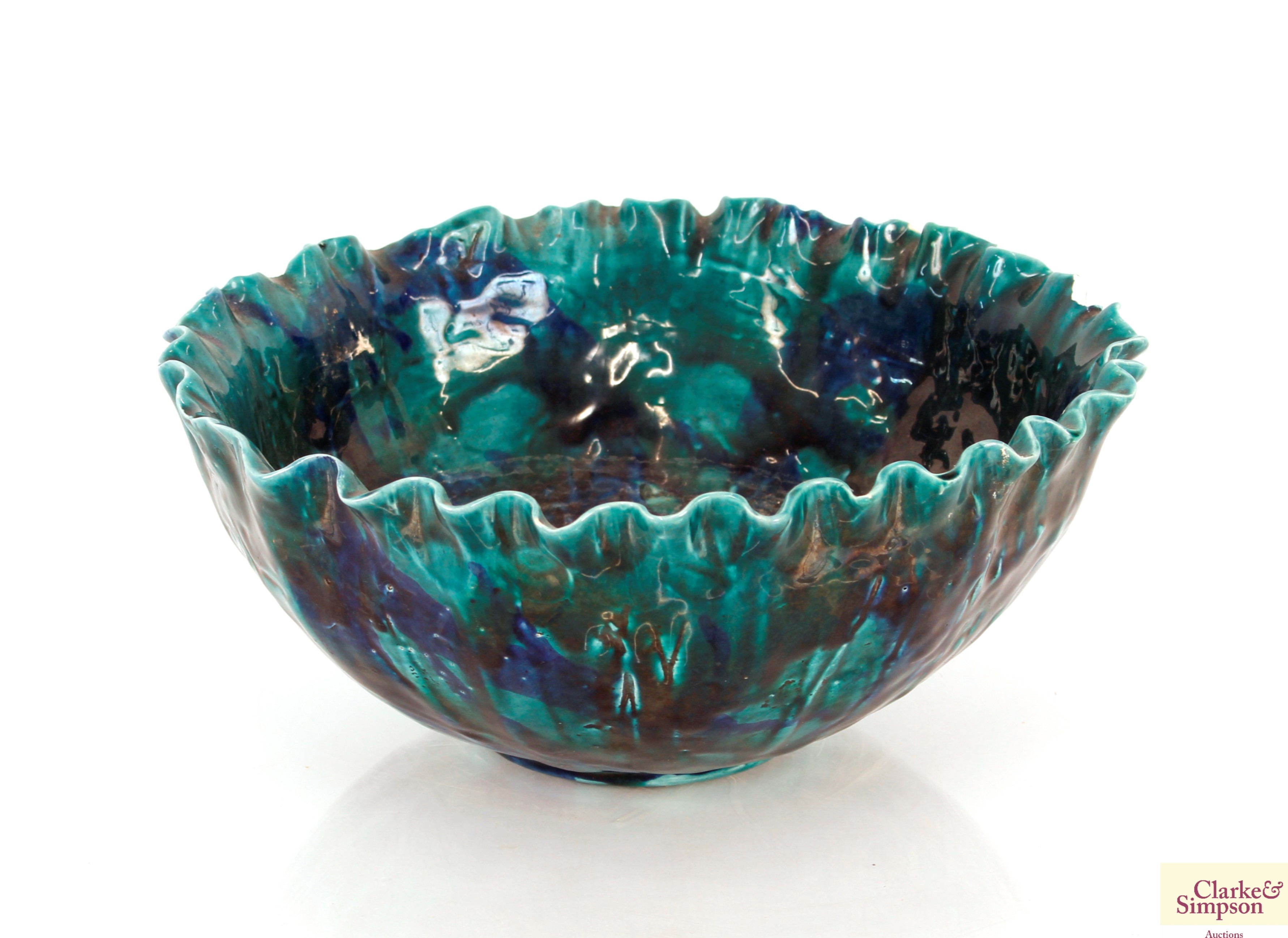 A turquoise glazed Studio Pottery bowl, with leaf