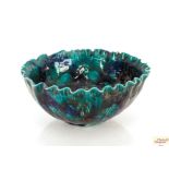 A turquoise glazed Studio Pottery bowl, with leaf