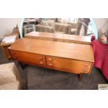 A teak Stag low sideboard fitted four drawers, rai