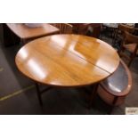 A circular Danish rosewood dining table in the des