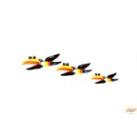 Three graduated Guinness Toucan style wall ornaments