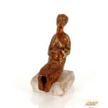 A bronze abstract figure of a seated woman detache