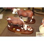 A Doulton model of Hereford bull on wooden plinth;