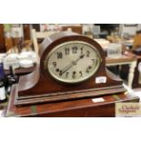 An oak cased three hole mantel clock