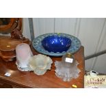 A blue glass bowl; glass lightshades etc.