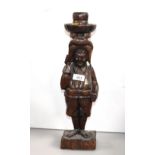 A carved wooden figure of a woman