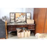 A mahogany dressing table and mirror