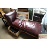 A red leather chaise lounge