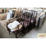 A pair of late 19th Century mahogany elbow chairs together with a matching bench