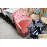 A pink upholstered nursing chair