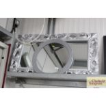 A pair of modern framed mirrors together with a ci