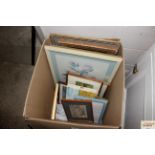 A box of miscellaneous pictures and prints
