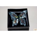A decorative boxed butterfly brooch