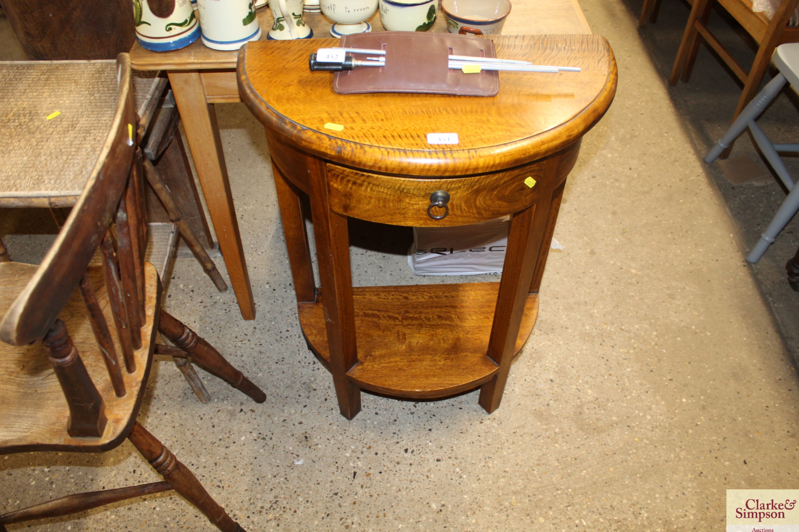 A demi-lune hall table fitted single drawer