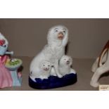 A 19th Century Staffordshire figure group of sheep and dogs