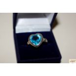 A 925 and blue topaz type heart shaped dress ring