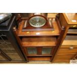 A glazed mahogany cabinet