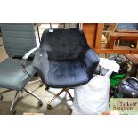 A black upholstered swivel chair