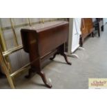 A mahogany drop leaf table