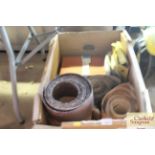 A box containing various rolls of sandpaper