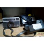 Two instamatic cameras