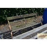 A wooden and metal garden bench