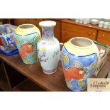 A Chinese vase and a pair of hand painted vases