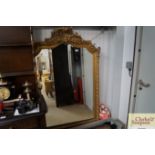 A large decorative gilt framed mirror