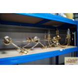 A brass ceiling light together with three brass wa