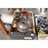 A box of various oil lamps and lanterns and shades