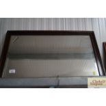 An oak framed bevel edged wall mirror