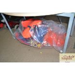 A bag containing various life jackets