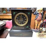 A Victorian black slate mantel clock