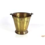 A small brass pail with swing handle