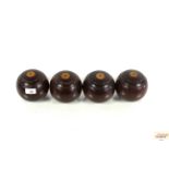 A set of four antique Lignum Vitae lawn bowls numb